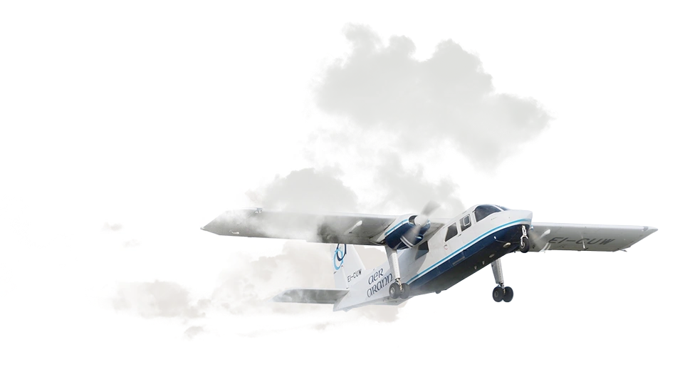 A small blue and white plane emitting a trail of white smoke from its left wing, flying at a slight angle against a transparent background.